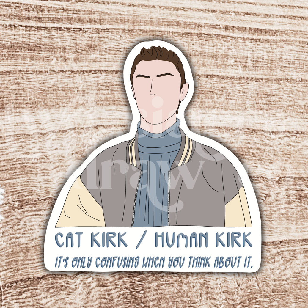 Hand-drawn Kirk Gleason sticker with the text, 'Cat Kirk/Human Kirk, it's only confusing when you think about it' underneath on a wooden background.