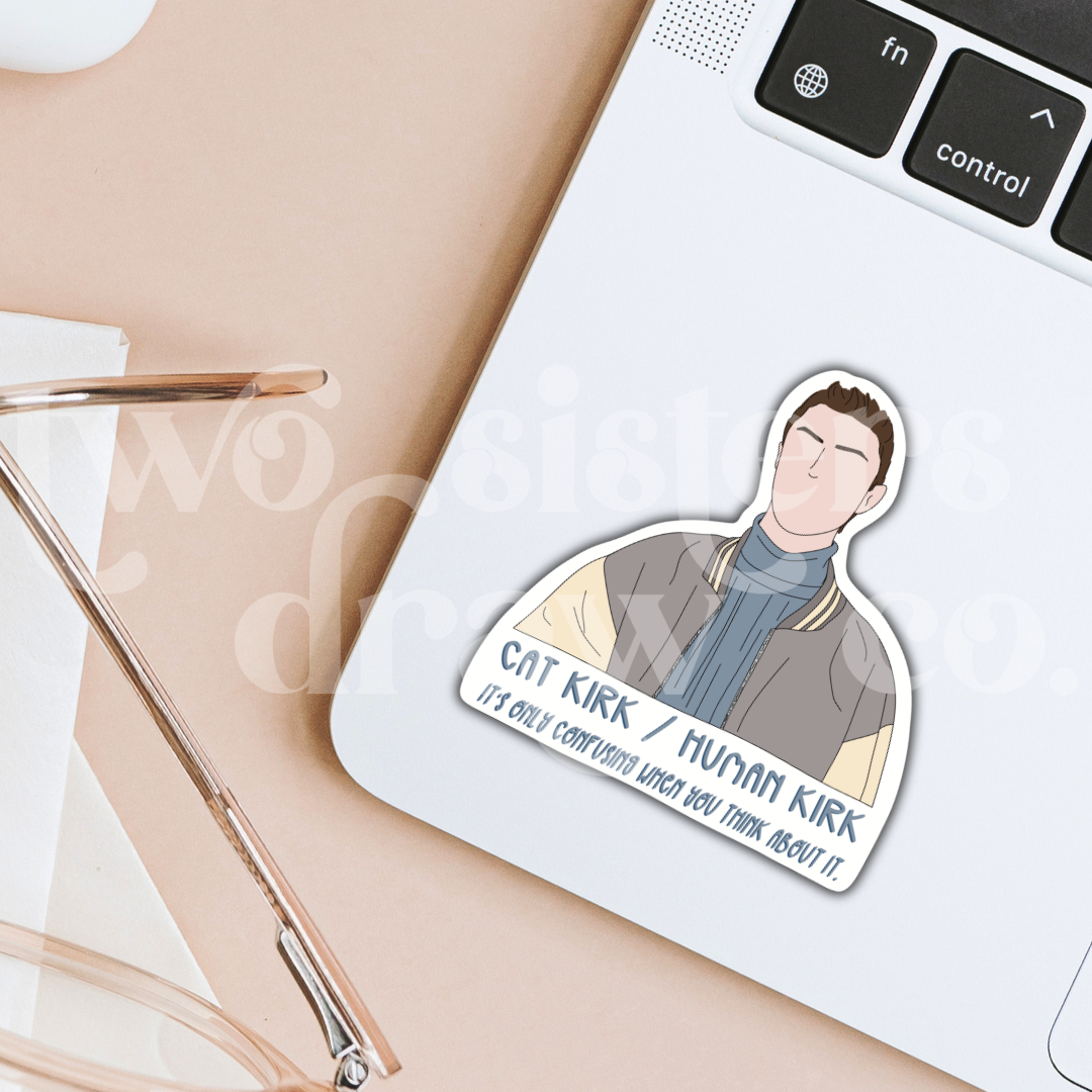 Hand-drawn Kirk Gleason sticker with the text, 'Cat Kirk/Human Kirk, it's only confusing when you think about it' underneath on a laptop.
