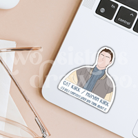 Hand-drawn Kirk Gleason sticker with the text, 'Cat Kirk/Human Kirk, it's only confusing when you think about it' underneath on a laptop.