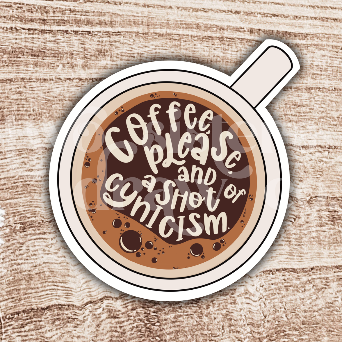Hand-drawn illustration of a coffee cup sticker with text 'Coffee please and a shot of cynicism' on a wooden background.