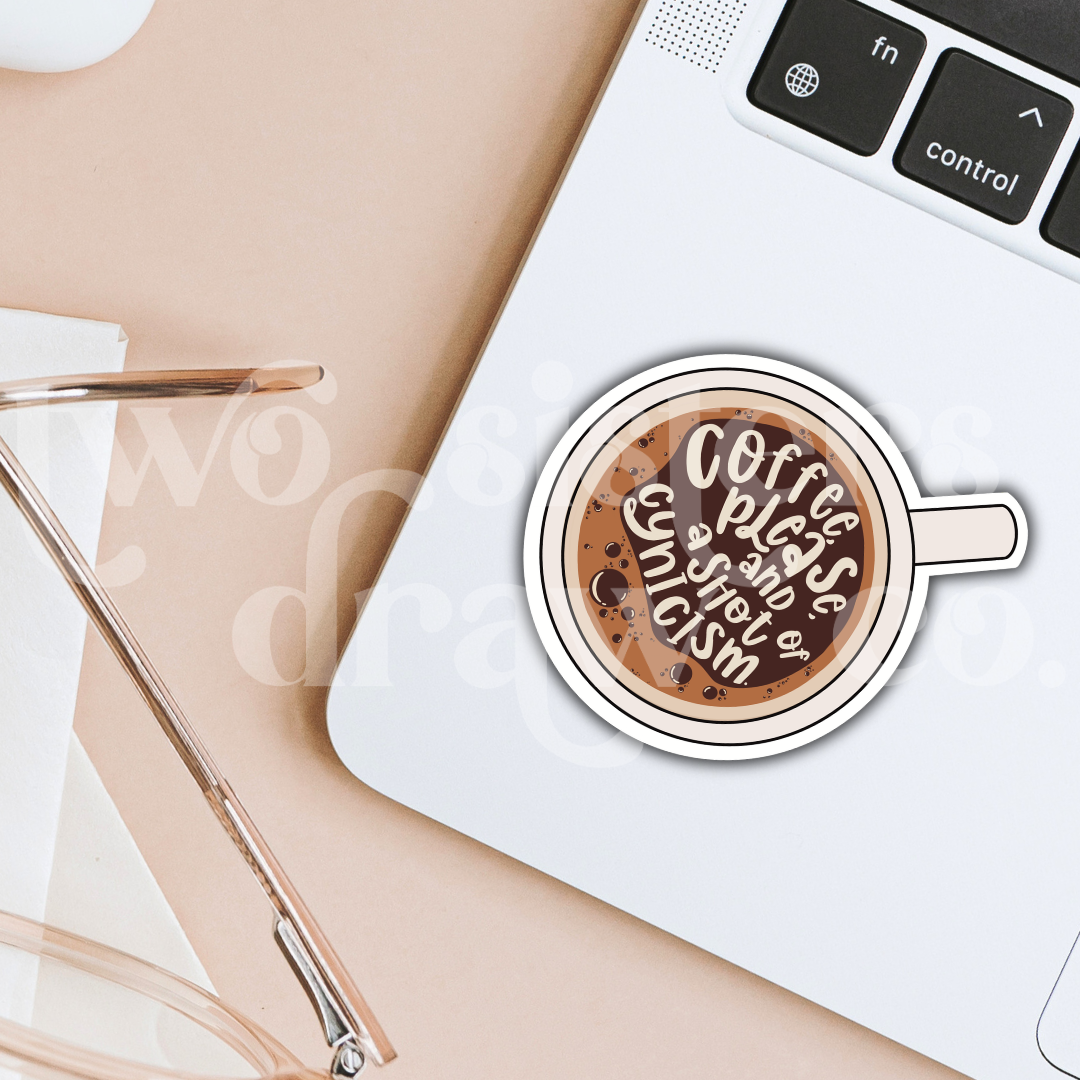 Hand-drawn illustration of a coffee cup sticker with text 'Coffee please and a shot of cynicism' on a laptop.