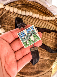 Bookish Era Hand-Painted Clay Bookmark | Adjustable Elastic Page Holder