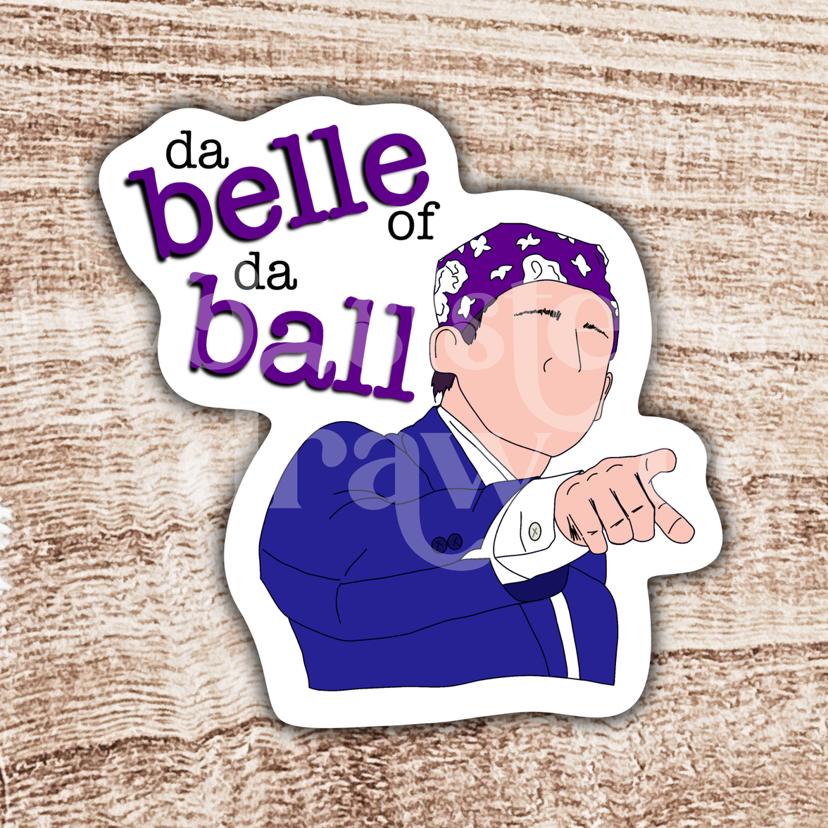 Hand-drawn sticker of Michael Scott pointing and wearing a purple bandana with the text 'da belle of da ball' on a wooden background.