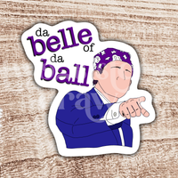 Hand-drawn sticker of Michael Scott pointing and wearing a purple bandana with the text 'da belle of da ball' on a wooden background.