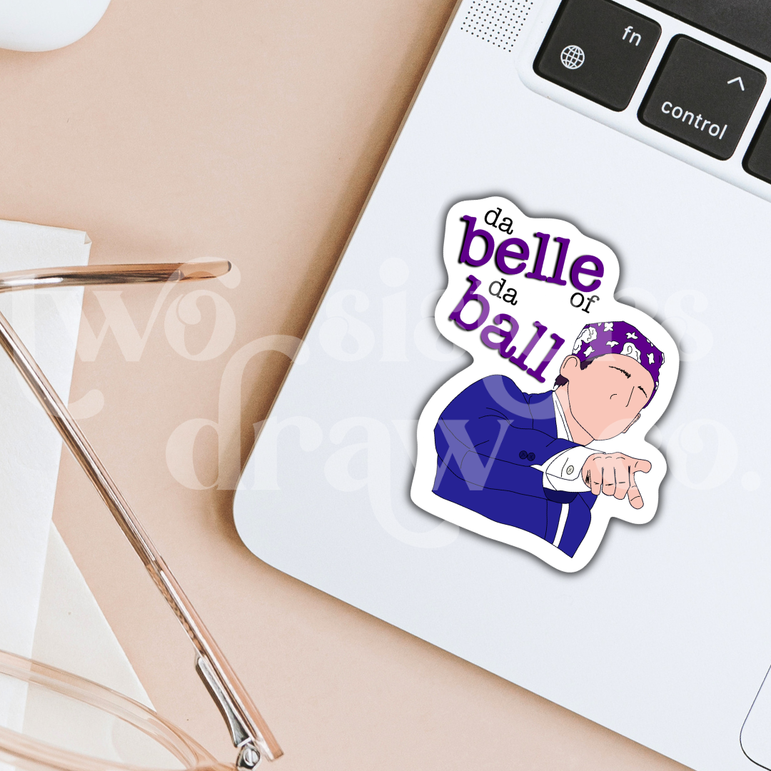 Hand-drawn sticker of Michael Scott pointing and wearing a purple bandana with the text 'da belle of da ball' on a laptop.