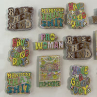 Several handmade, polymer clay magnets featuring 3D bubble lettering in sherbet and neutral color palettes on a white background.